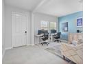 Bright home office featuring tile floors, dual workstations, and neutral decor at 5220 Red Coral Cir, Mount Dora, FL 32757
