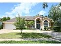 Stunning single-story home with a well-maintained lawn, inviting driveway, and desirable curb appeal at 787 High Grove Park Ct, Oviedo, FL 32765