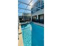 Spacious screened-in pool with a spa, ideal for enjoying sunny days at 851 Drop Shot Dr, Davenport, FL 33896