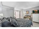 Spacious bedroom showcasing a well-made bed and a dresser with a mirror and decor at 141 Lewfield Circle # 141, Winter Park, FL 32792