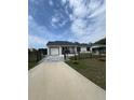 Inviting single-story home with a well-maintained lawn and a cozy front porch at 1620 Hialeah St, Orlando, FL 32808
