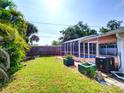 Spacious backyard with mature trees, and an enclosed pool ideal for outdoor enjoyment at 1670 Clematis Ln, Winter Park, FL 32792