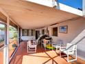 Enclosed lanai with patio furniture, perfect for enjoying the outdoors in comfort and style at 1670 Clematis Ln, Winter Park, FL 32792