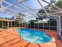 Enclosed backyard pool with deck, offering a private oasis for relaxation and recreation at 1670 Clematis Ln, Winter Park, FL 32792