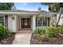 Inviting front entrance with decorative door and well-maintained landscaping at 1947 Broadleaf Ct, Windermere, FL 34786