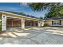 Spacious three-car garage featuring ample storage space and an expansive concrete driveway at 1947 Broadleaf Ct, Windermere, FL 34786