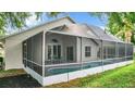 Enjoy this refreshing screened-in pool, perfect for relaxing or entertaining, with outdoor seating and well-manicured lawn at 2124 Fish Eagle St, Clermont, FL 34714