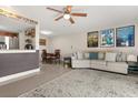 Spacious living room with tile flooring, a ceiling fan, and ample natural light at 214 Majors Ln # C, Kissimmee, FL 34743