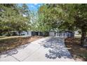 Charming single-Gathering home with long driveway and shade trees at 2420 Kerridale St, Deltona, FL 32738