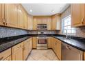 Updated kitchen with stainless steel appliances and granite countertops at 2420 Kerridale St, Deltona, FL 32738