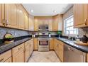 Updated kitchen with stainless steel appliances and granite countertops at 2420 Kerridale St, Deltona, FL 32738
