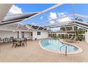 Sparkling pool area with screened enclosure, lounge chairs and outdoor dining space at 407 Westchester Dr, Altamonte Springs, FL 32701