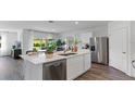Bright kitchen with a large island and stainless steel appliances at 5132 Gopher Apple Dr, Apopka, FL 32712