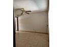 Bedroom with tiled floor, fan and a neutral color palette, flooded with natural light from the window at 6616 Blanche Ct, Orlando, FL 32818