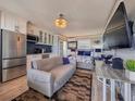 Cozy condo living room and kitchen combo with modern decor and comfortable furnishings at 935 S Atlantic Ave # 244, Daytona Beach, FL 32118