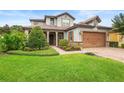 Beautiful landscaped lawn, stone accents, and brick driveway at 1365 Tappie Toorie Cir, Lake Mary, FL 32746