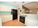 Kitchen with modern appliances and view of the living room at 1975 Waldo St, Orlando, FL 32806