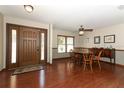 Welcoming entryway with hardwood floors, dining area, and natural light streaming through the windows at 414 Bonifay Ave, Orlando, FL 32825