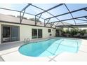 Relaxing screened-in pool area with bright blue water, ideal for Florida living at 414 Bonifay Ave, Orlando, FL 32825