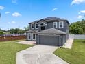 Beautiful two-story house featuring a spacious driveway, well-maintained landscaping, and neutral exterior paint at 470 Regal Downs Cir, Winter Garden, FL 34787