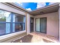 Welcoming entrance with tiled patio, large windows, and sliding glass door with a view at 489 Meadowood Blvd, Fern Park, FL 32730