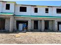 New construction townhomes with concrete block first story and sheathed second story at 4252 Campsite Loop, Orlando, FL 32824