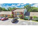 Townhomes feature colorful exteriors, landscaping and convenient parking areas at 4952 Tangerine Ave # 4952, Winter Park, FL 32792