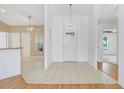 Welcoming foyer features tile flooring, contemporary lighting, and neutral decor at 5382 Sw 84Th Pl, Ocala, FL 34476