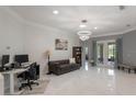 Bright living room with modern lighting, neutral walls, and a comfortable seating area at 9780 Cypress Pine St, Orlando, FL 32827