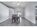 Dining room with gray walls, chair railing, and a sliding glass door leading to the backyard at 9821 8Th Ave, Orlando, FL 32824