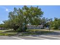 Well-kept single-story home with mature trees, set on a corner lot at 985 N Village Dr, Deltona, FL 32725