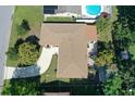 Aerial view of a single-Gathering home showing the roof, driveway, and surrounding yard at 1135 Plato Ave, Orlando, FL 32809