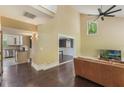 Spacious living room with hardwood floors and large window, creating an inviting atmosphere at 120 E Greentree Ln, Lake Mary, FL 32746