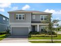 Inviting two-story home with a meticulously maintained lawn and classic design at 13822 Destin Beach Ln, Orlando, FL 32827