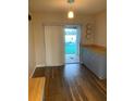 Dining area with wood floors and access to the patio at 1484 Magellan Cir # 403, Orlando, FL 32818