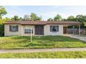 Charming single-story home featuring a covered carport, neutral paint, and a well-maintained front yard at 2822 Fulford St, Deltona, FL 32738