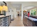 Bright and spacious foyer with neutral tile flooring and views into the formal living room at 33919 Terragona Dr, Sorrento, FL 32776