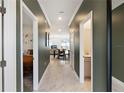 Inviting hallway view showcasing doors to the bathroom, bedroom, and living spaces at 4184 Paragraph Dr, Kissimmee, FL 34746