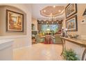 Elegant living room features coffered ceiling, fireplace, and picture window at 5241 Vista Club Run, Sanford, FL 32771