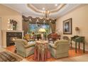 Inviting living room showcases grand piano, fireplace, and outdoor view at 5241 Vista Club Run, Sanford, FL 32771