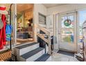 Enclosed porch featuring stairs, interior access, an eclectic mix of furnishings, and plenty of natural light at 9000 Us Highway 192 # 115, Clermont, FL 34714
