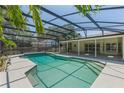 Relax in this refreshing pool, fully screened for privacy and comfort, steps away from the home's back door at 957 Yellow Rose Dr, Orlando, FL 32818