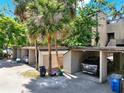 Carport area offering convenient covered parking spaces and storage units at 109 Crown Oaks Way # 109, Longwood, FL 32779