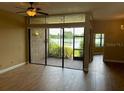 Bright living area with sliding glass doors leading to an outdoor patio with a lake view at 1252 Lake Willisara Cir # Ge, Orlando, FL 32806