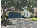 Charming one-story home featuring a two-car garage and beautiful exterior color scheme with lovely landscaping at 126 San Carlo Rd, Davenport, FL 33896