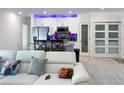 Open-concept living area flows into a modern kitchen with stainless steel appliances at 1418 Kissimmee Ct, Kissimmee, FL 34759