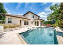 Backyard pool area perfect for relaxing, with outdoor seating and well-maintained landscaping, offering a private oasis at 1420 Palmer Ave, Winter Park, FL 32789