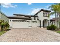 Charming two-story home with three-car garage and brick paved driveway at 1429 Arbitus Cir, Oviedo, FL 32765