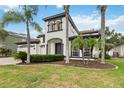 Stunning two-story home with lush landscaping and a three car garage at 1429 Arbitus Cir, Oviedo, FL 32765