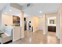 Open-concept living space with modern kitchen, stainless steel appliances, and convenient laundry area at 14501 Grove Resort Ave # 2451, Winter Garden, FL 34787